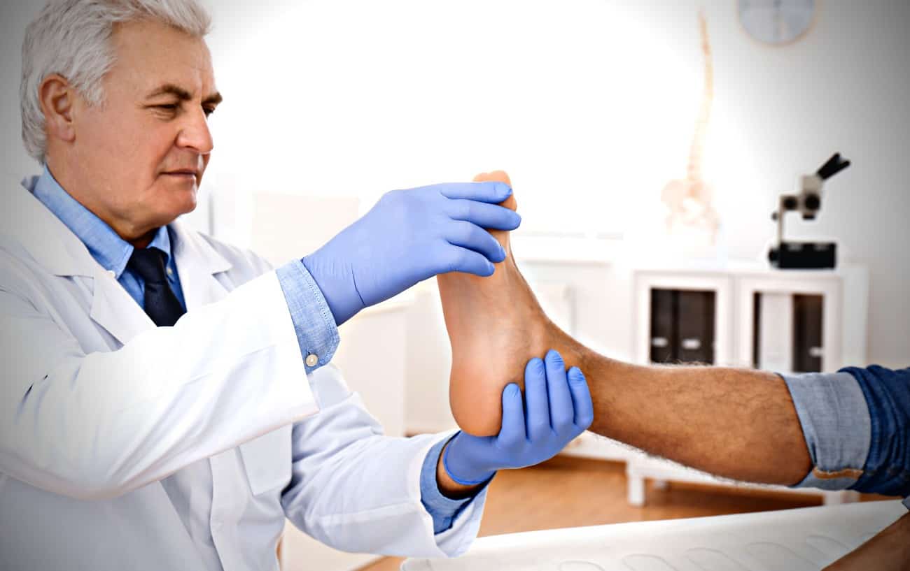 A doctor looking at someone's foot.