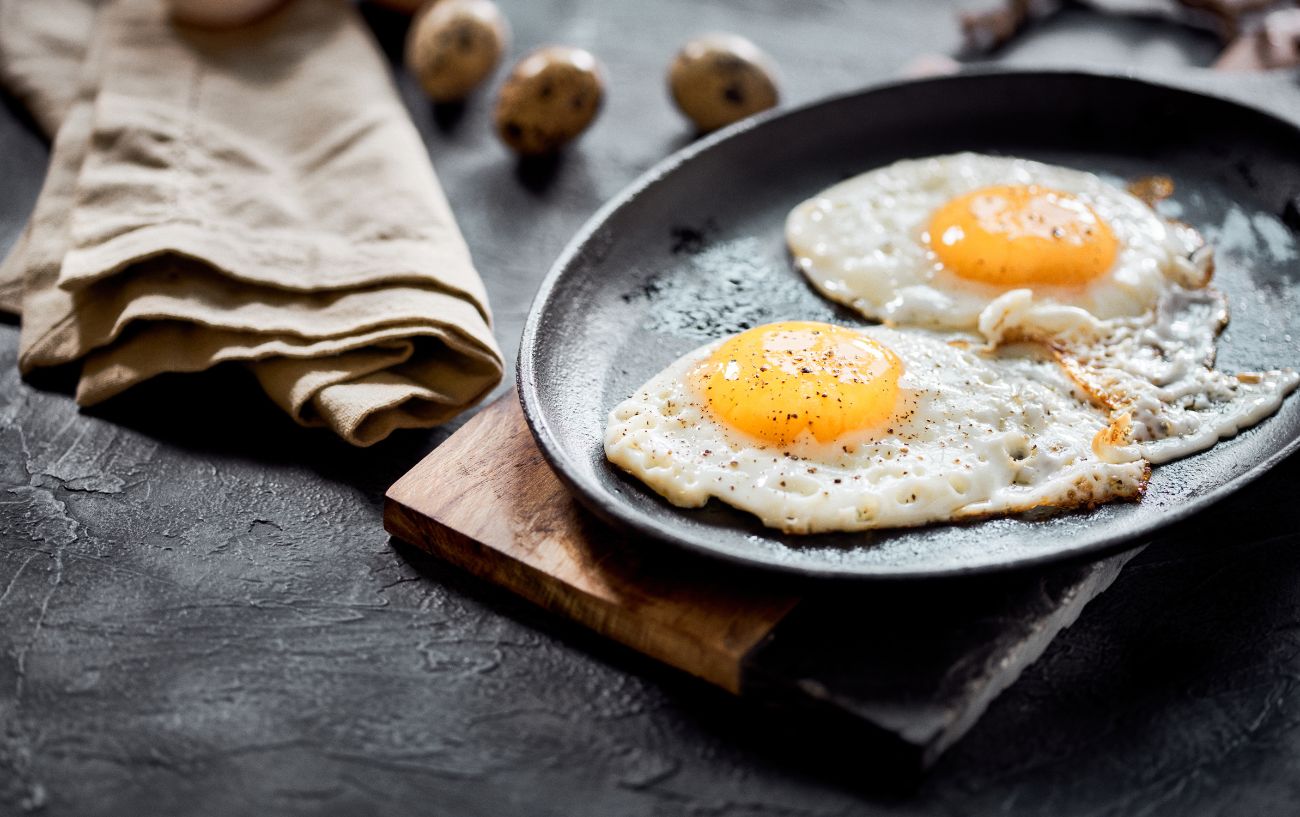 A pan with two fried eggs on it.