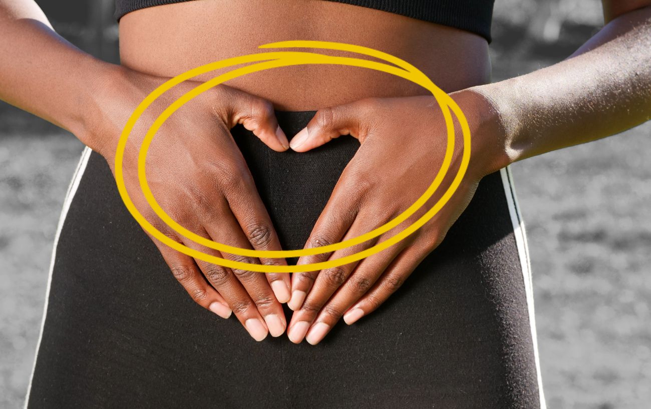 a person holding their hands over their stomach