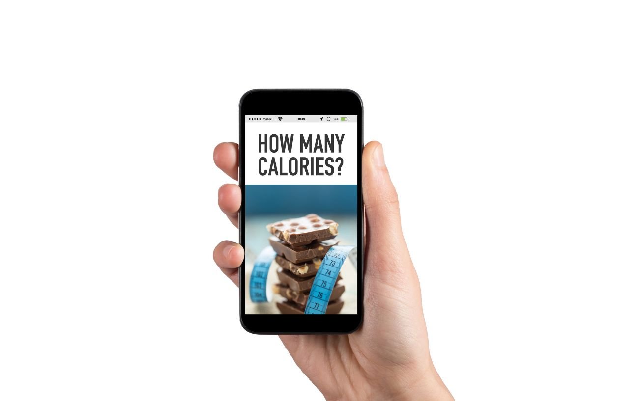 A person holding a phone that says "How many calories?"