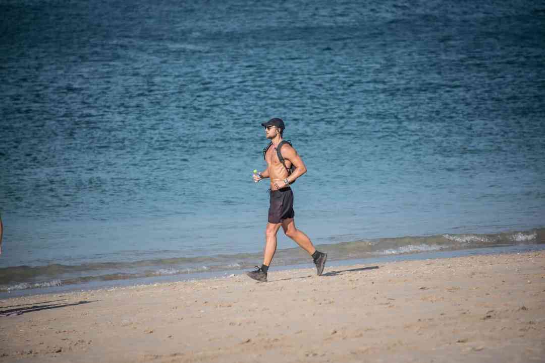 a man running on a beach