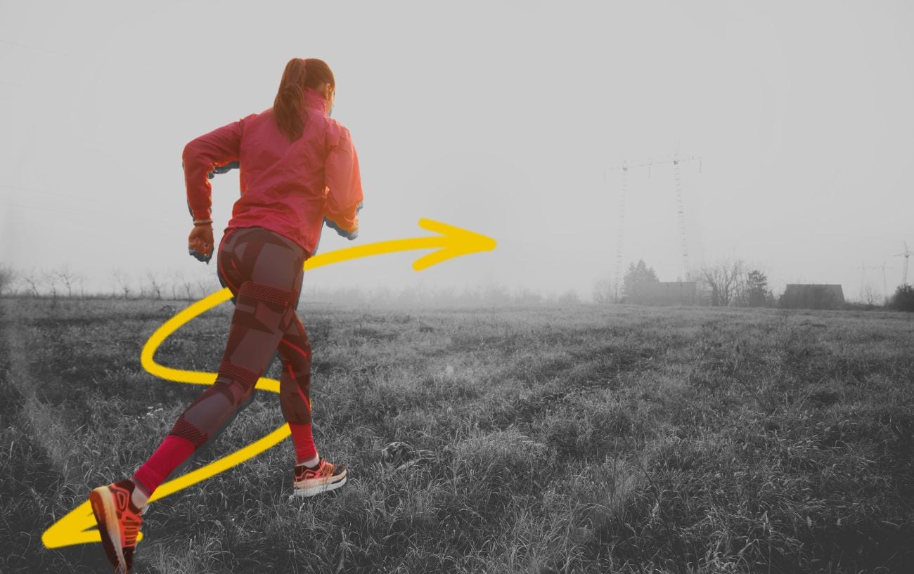 a woman running in a field