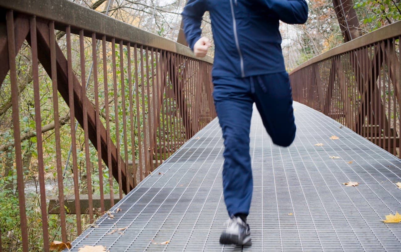 a person running on a bridge