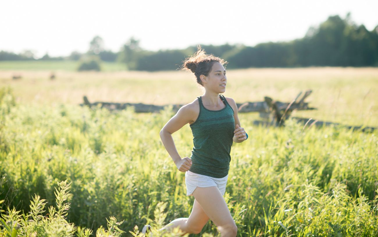 A person running through a field.