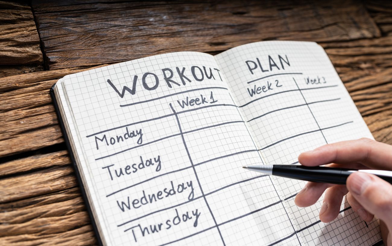A workout plan in a notebook.